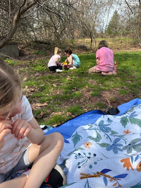 Kids exploring a creek during outdoor play at summer camp near Valley Forge PA