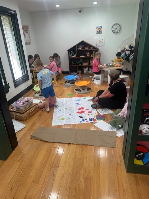 Kids doing messy art painting at summer camp at The Clubhouse Phoenixville PA
