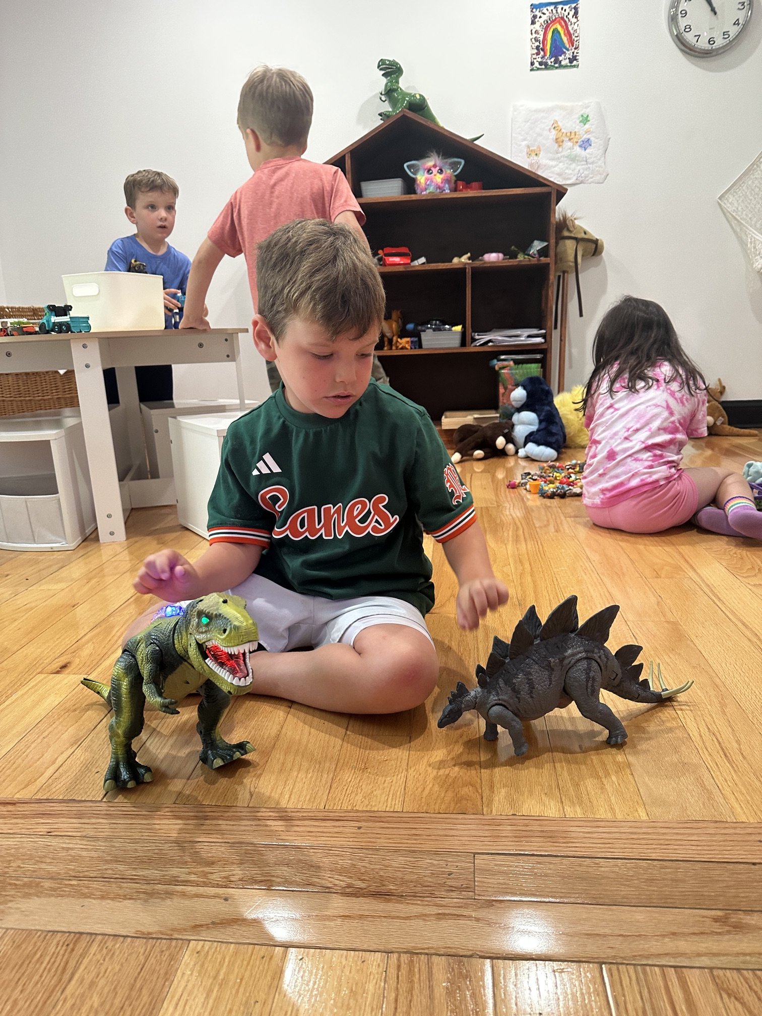 Toddlers and preschoolers in imaginative dinosaur play at The Clubhouse Phoenixville — educator-led enrichment for little kids