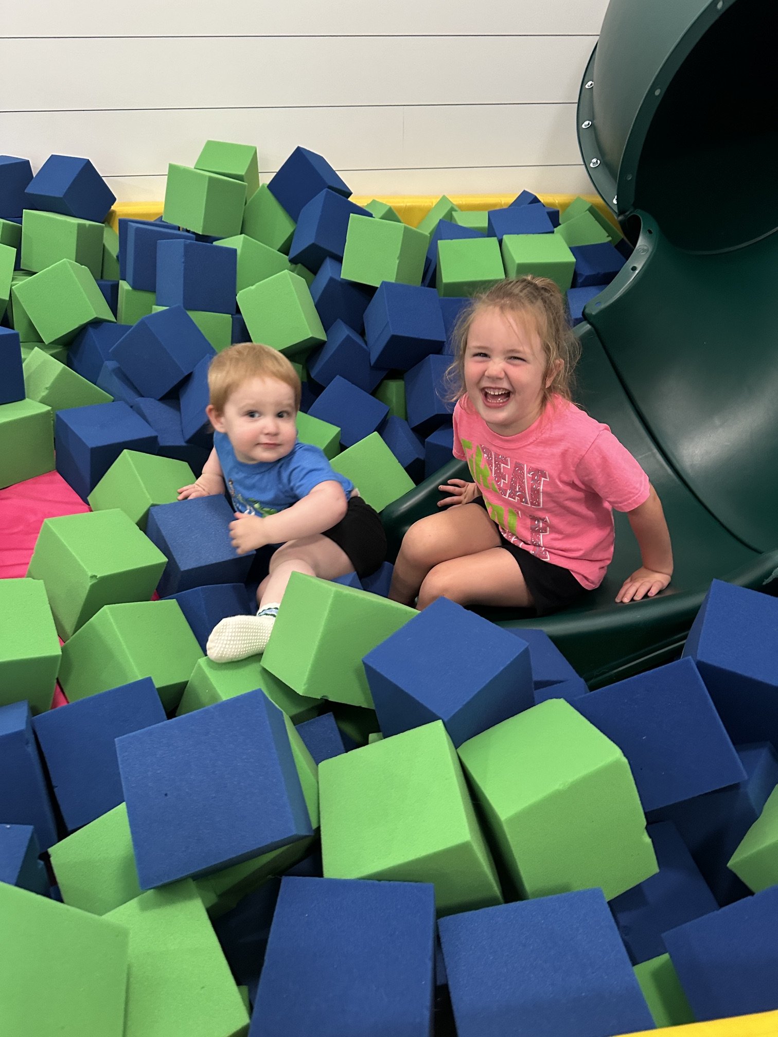 Child playing in the foam block pit and soft play area at The Clubhouse — toddler play space in Phoenixville PA
