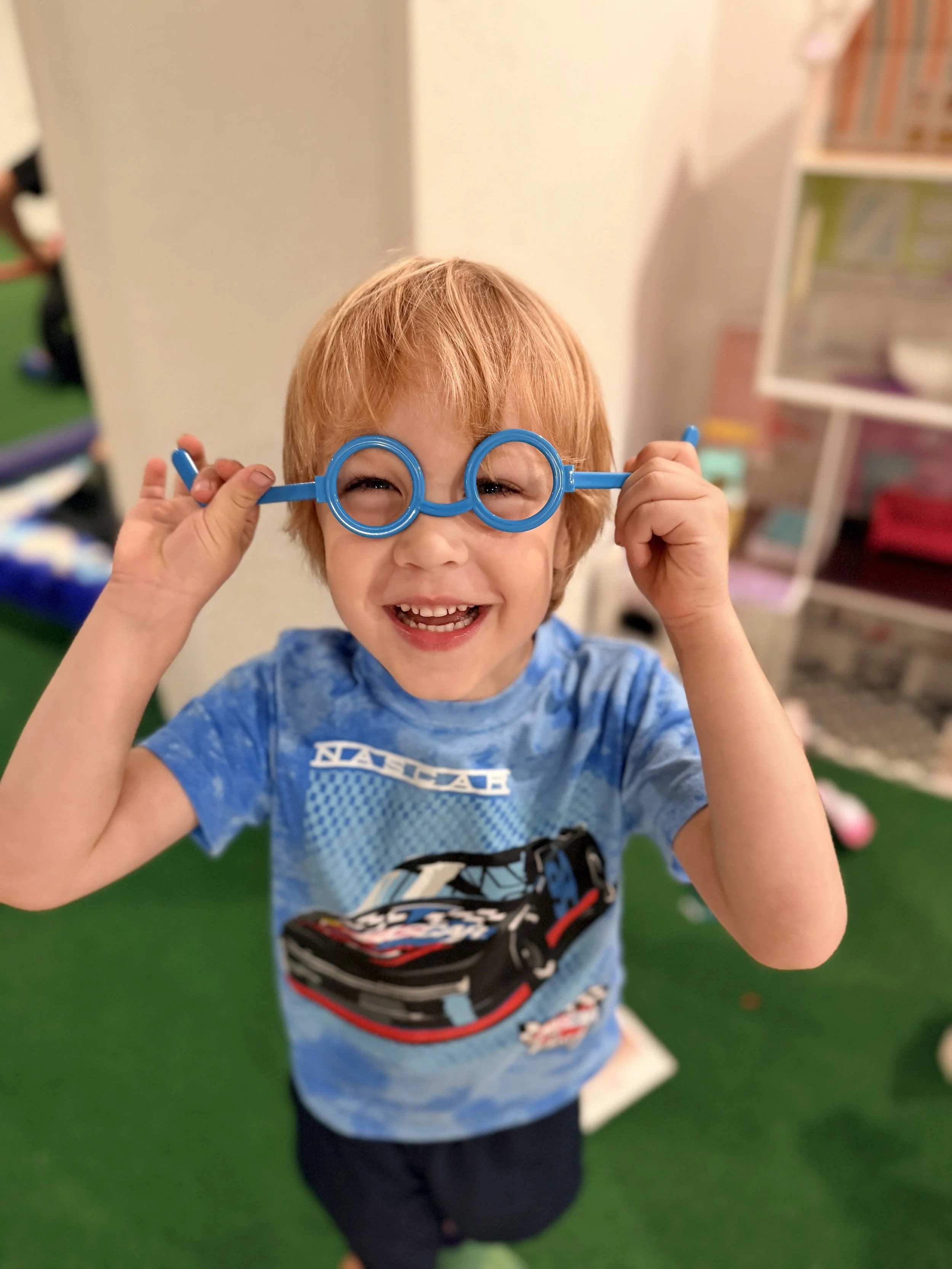 A preschooler in dress-up clothes
    during pretend play at The Clubhouse Phoenixville
