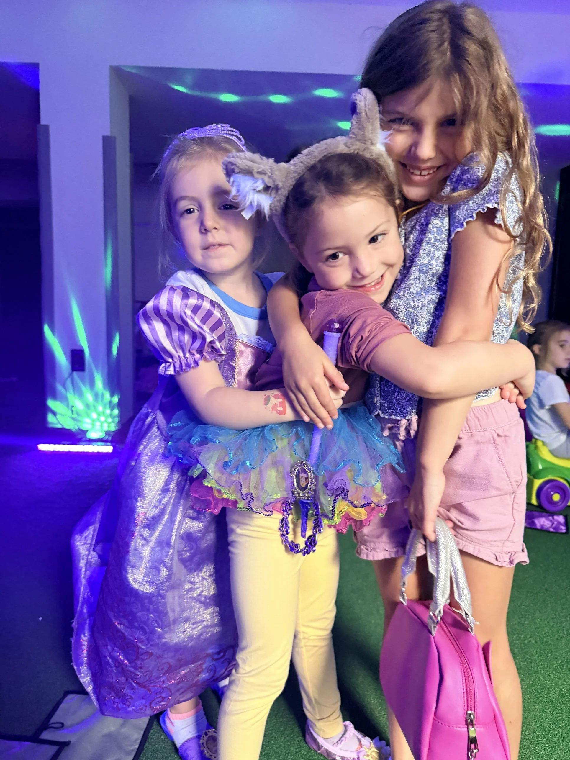 Kids in dress-up costumes playing pretend together