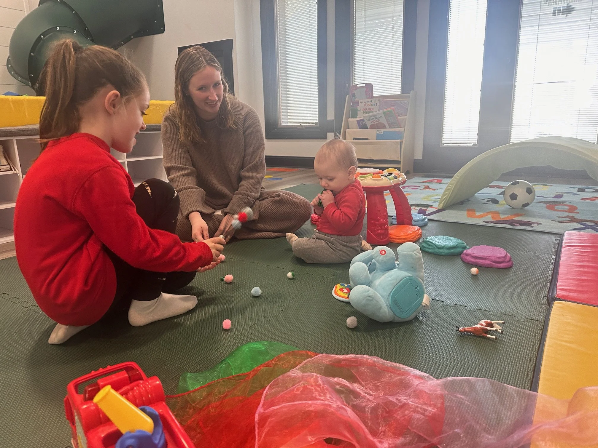 Educator-led enrichment session with kids playing at The Clubhouse in Phoenixville PA