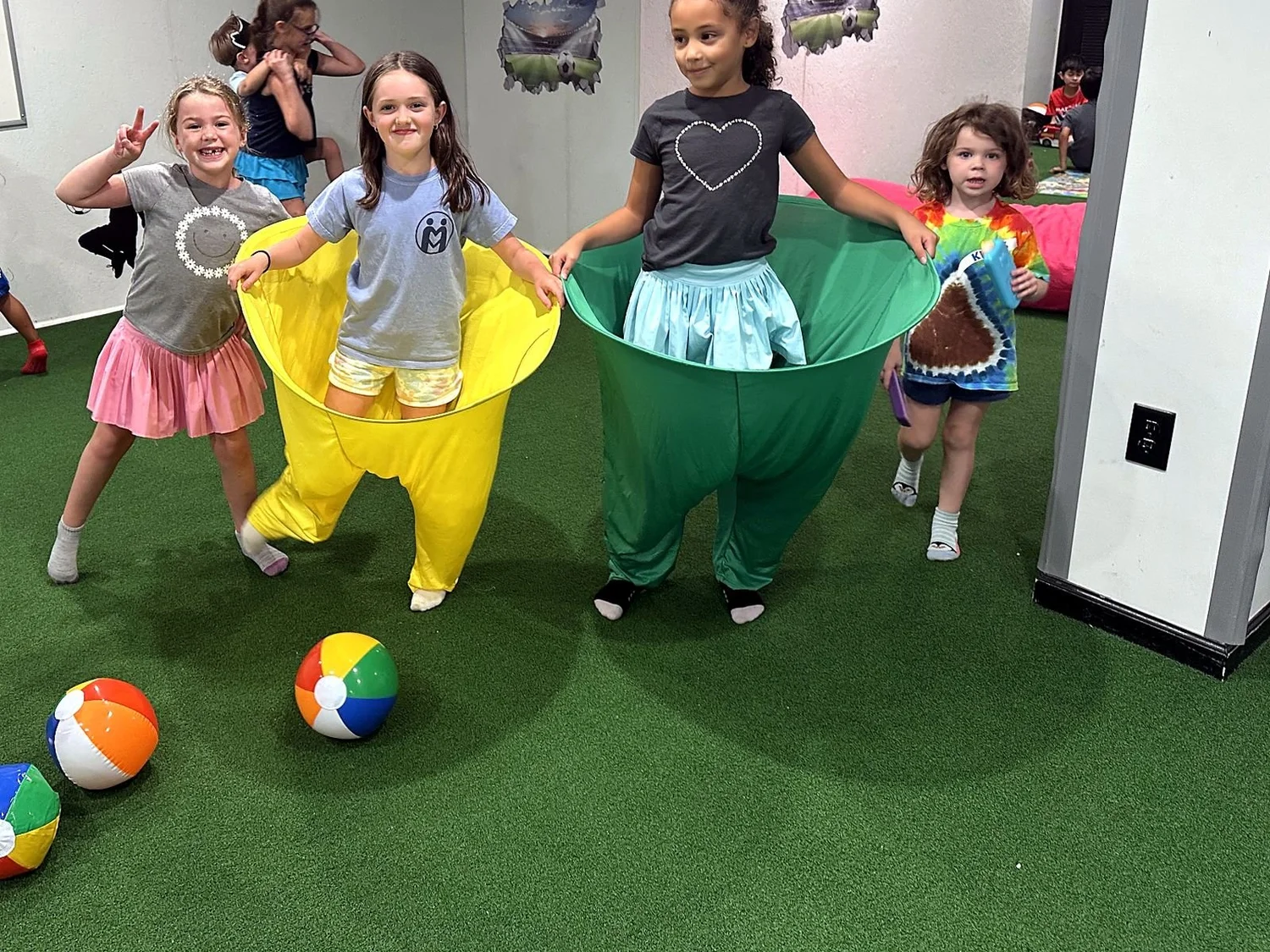 Smiling kids playing a group game at Clubhouse Move Club
