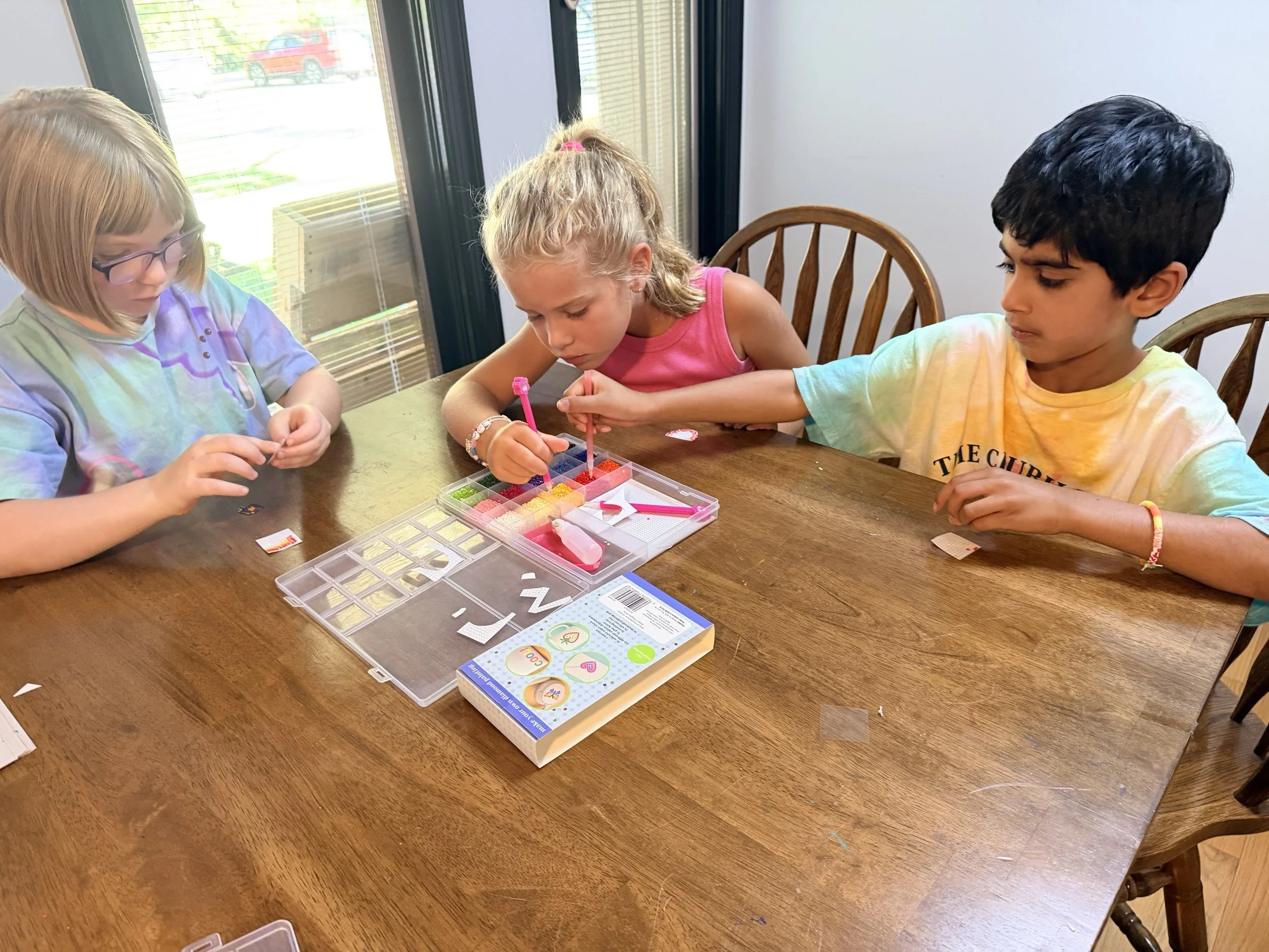 Child working on a diamond painting