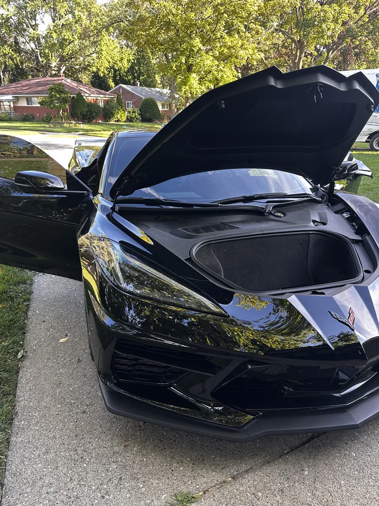 Black Chevrolet Corvette C8 with the front trunk open