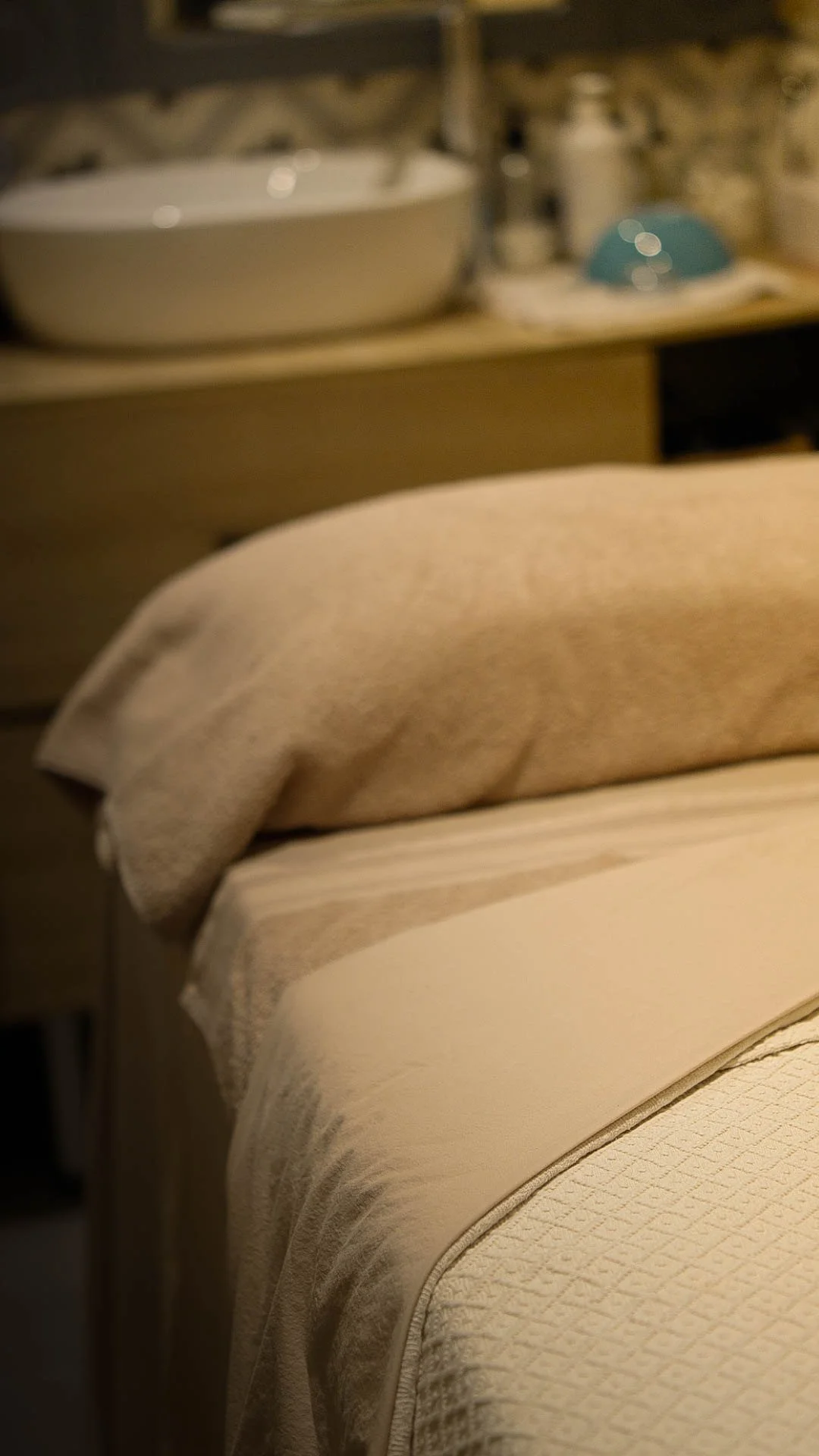 A massage treatment room prepared for a guest