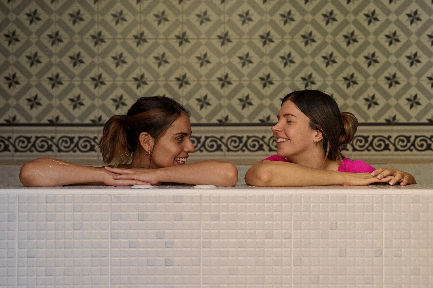 Two guests sharing a quiet moment in the jacuzzi