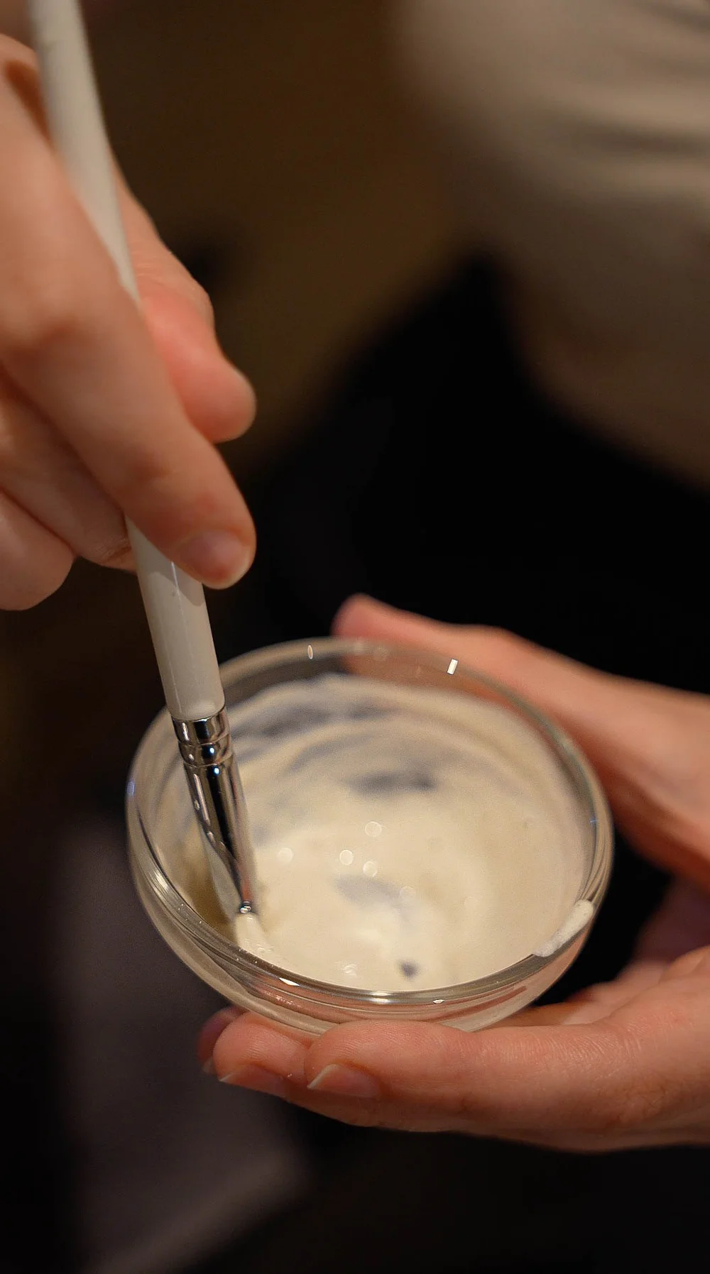 A mask bowl and spatula prepared for a facial
