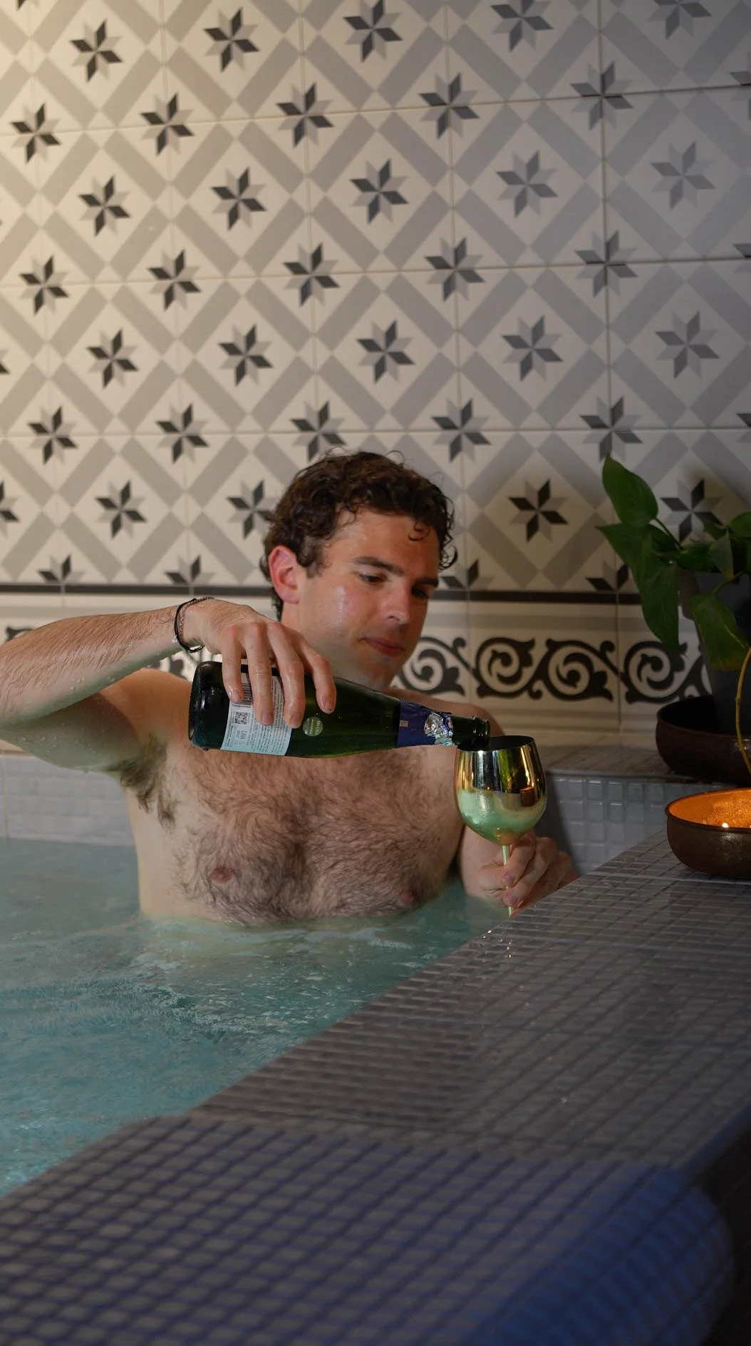 Cava being poured in the jacuzzi