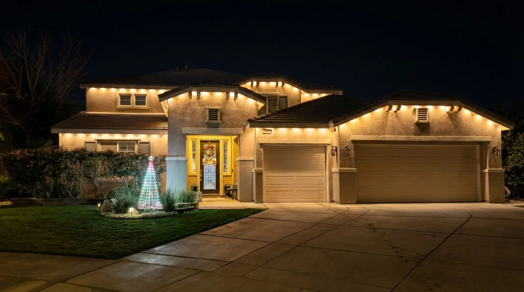 Permanent outdoor lighting installed on a two-story home in Imperial Valley by Mr. Juniper