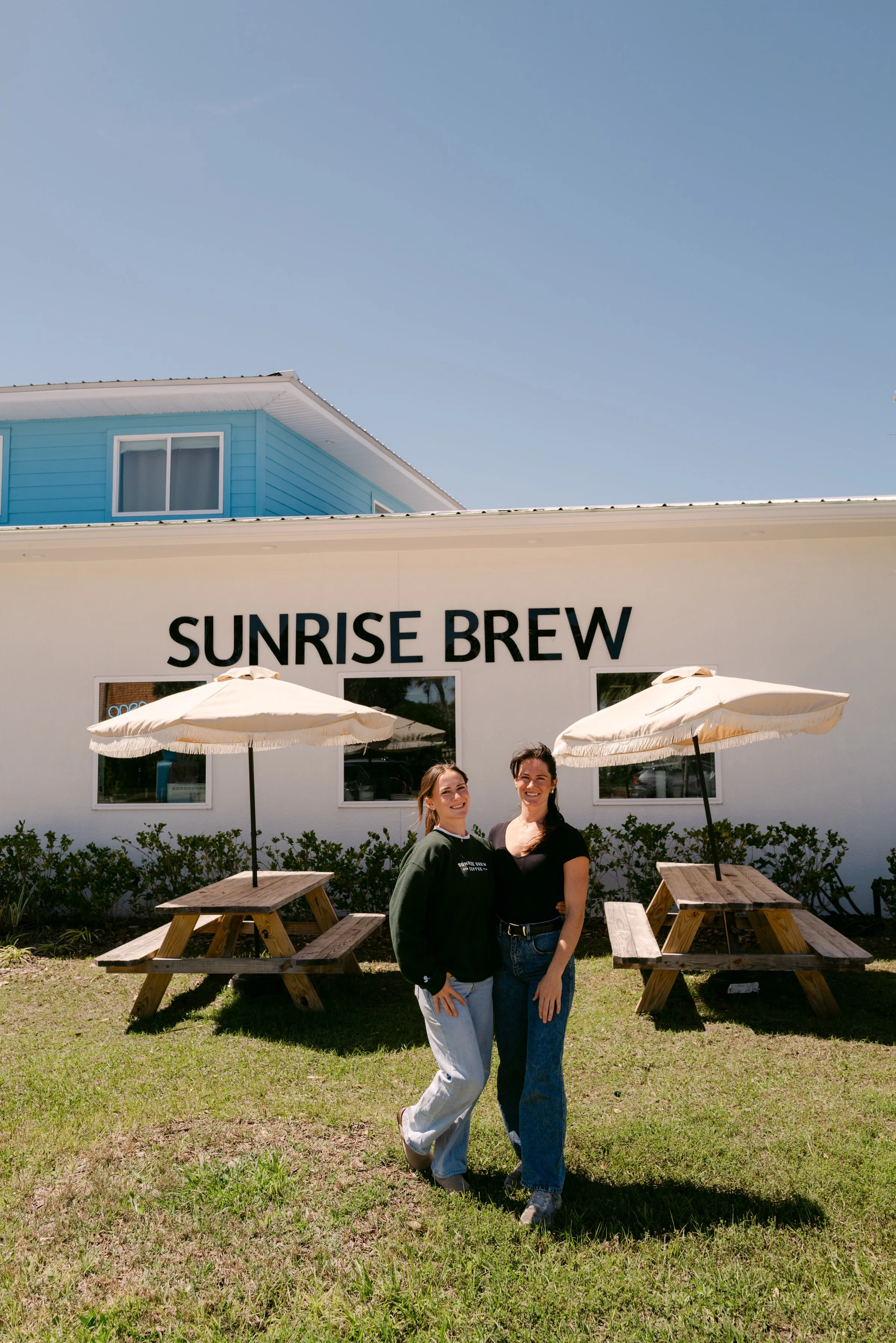 Maggie and Tessa outside the Sunrise Brew Island Coffee Shop