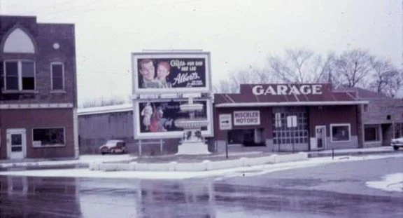The Mischler Motors dealership building in Vincennes, Indiana, with a Crosley parked at the left of the garage.