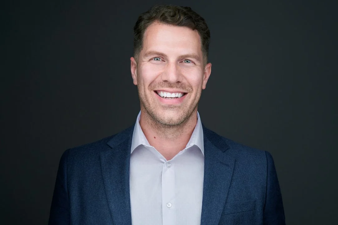 Dark Mode corporate headshot of Sheldon from ThreeHive Consulting, photographed in Edmonton