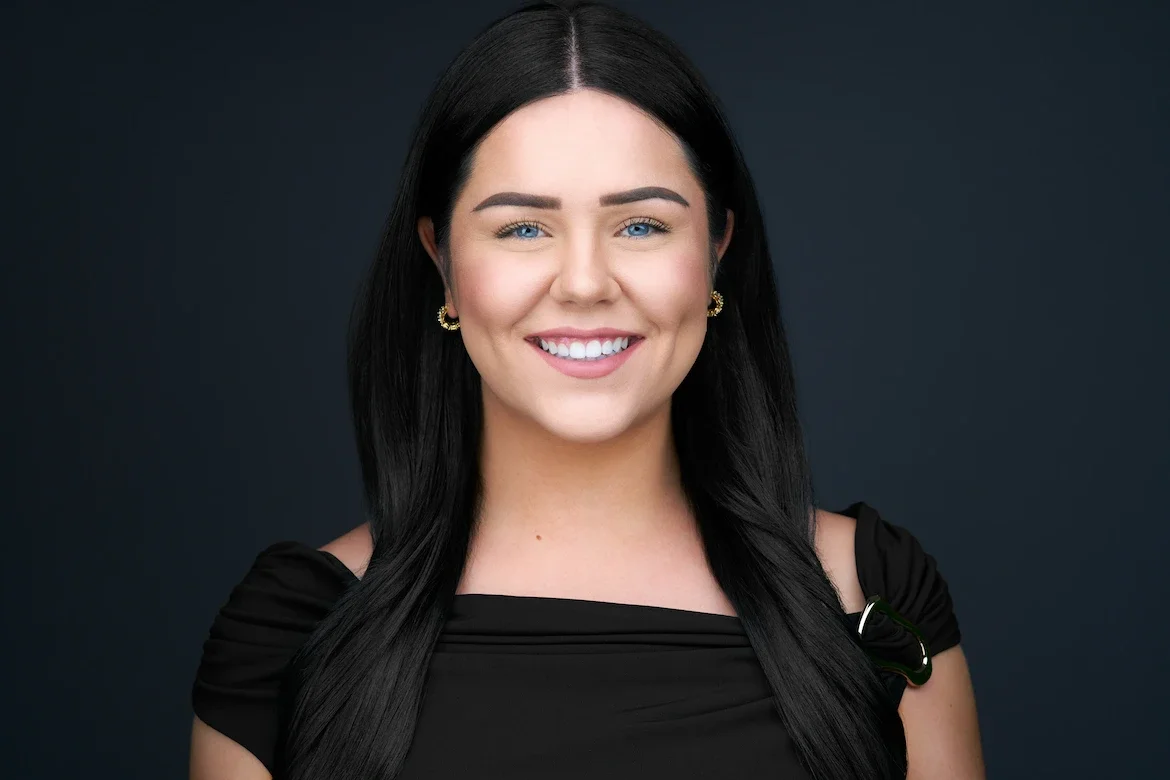 Professional headshot of Faith on a dark backdrop at Maverick Studios in Edmonton