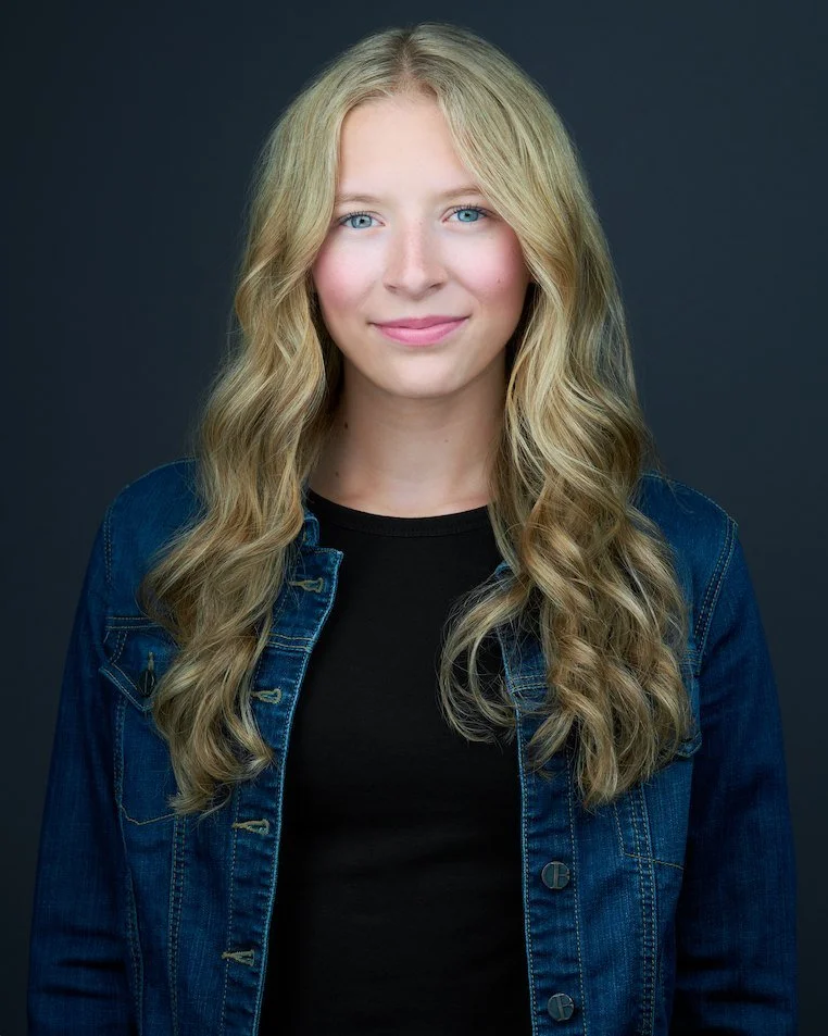 Individual headshot of Breckyn on a dark backdrop, photographed at Maverick Studios in Edmonton