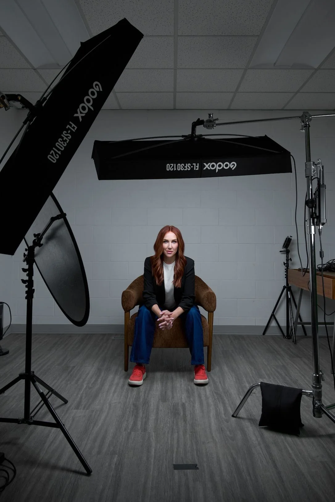 Mama Nurse Tina being photographed during a headshot session in the Maverick Studios studio in west Edmonton