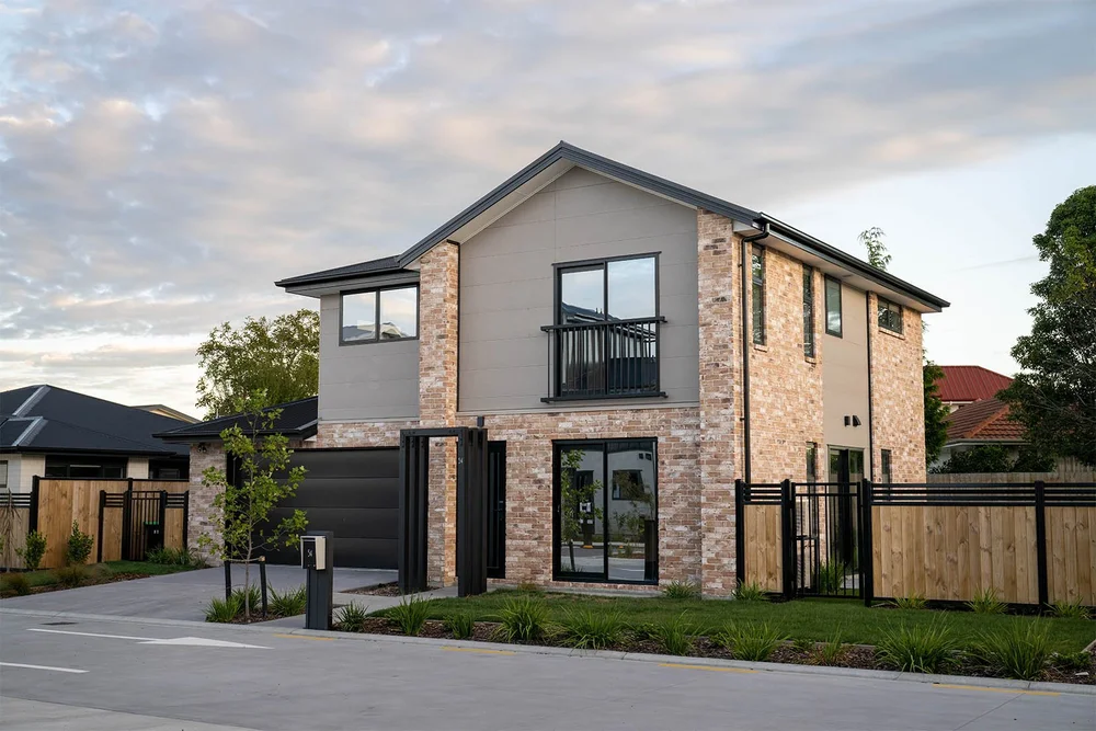 Brick and grey-clad home with a defined garden entrance at Mohua Lane, Christchurch