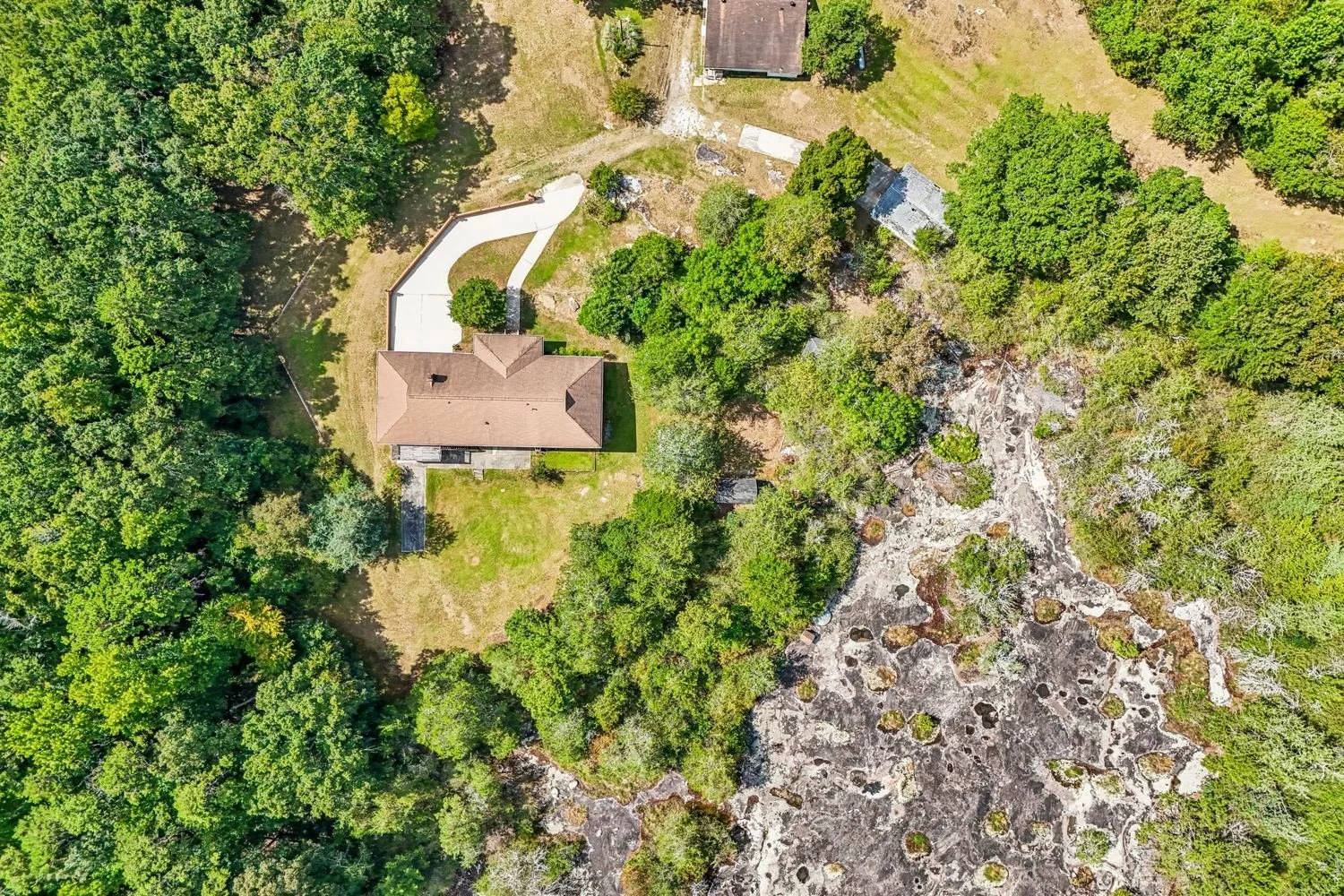 7.11 acres of trees, rock and room to roam