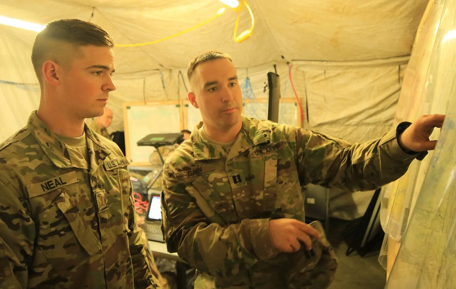 U.S. Army officers review plans during a cyber and electromagnetic activities field exercise