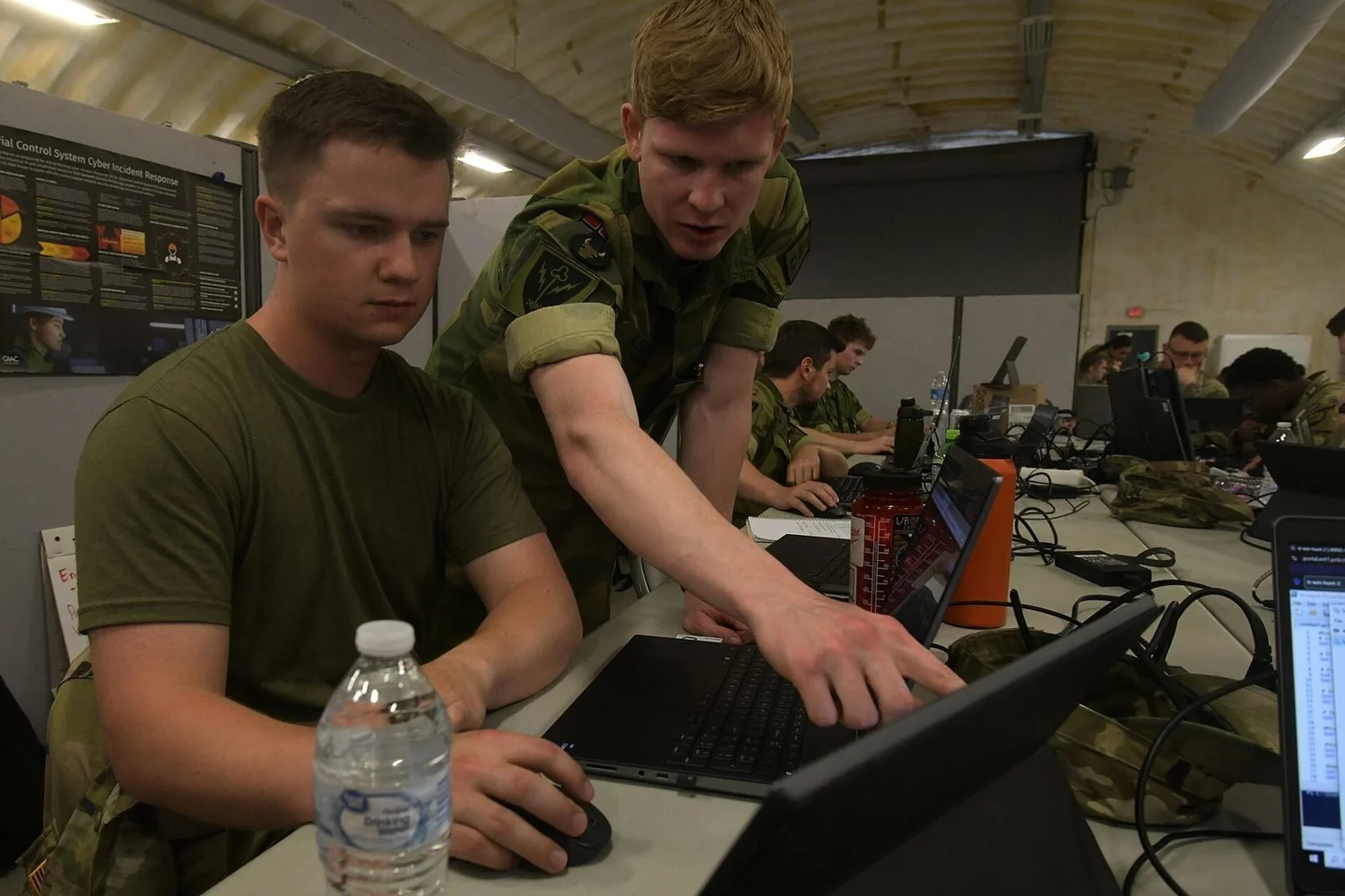 A U.S. Army cyber warfare operator works with a teammate during the Cyber Shield exercise