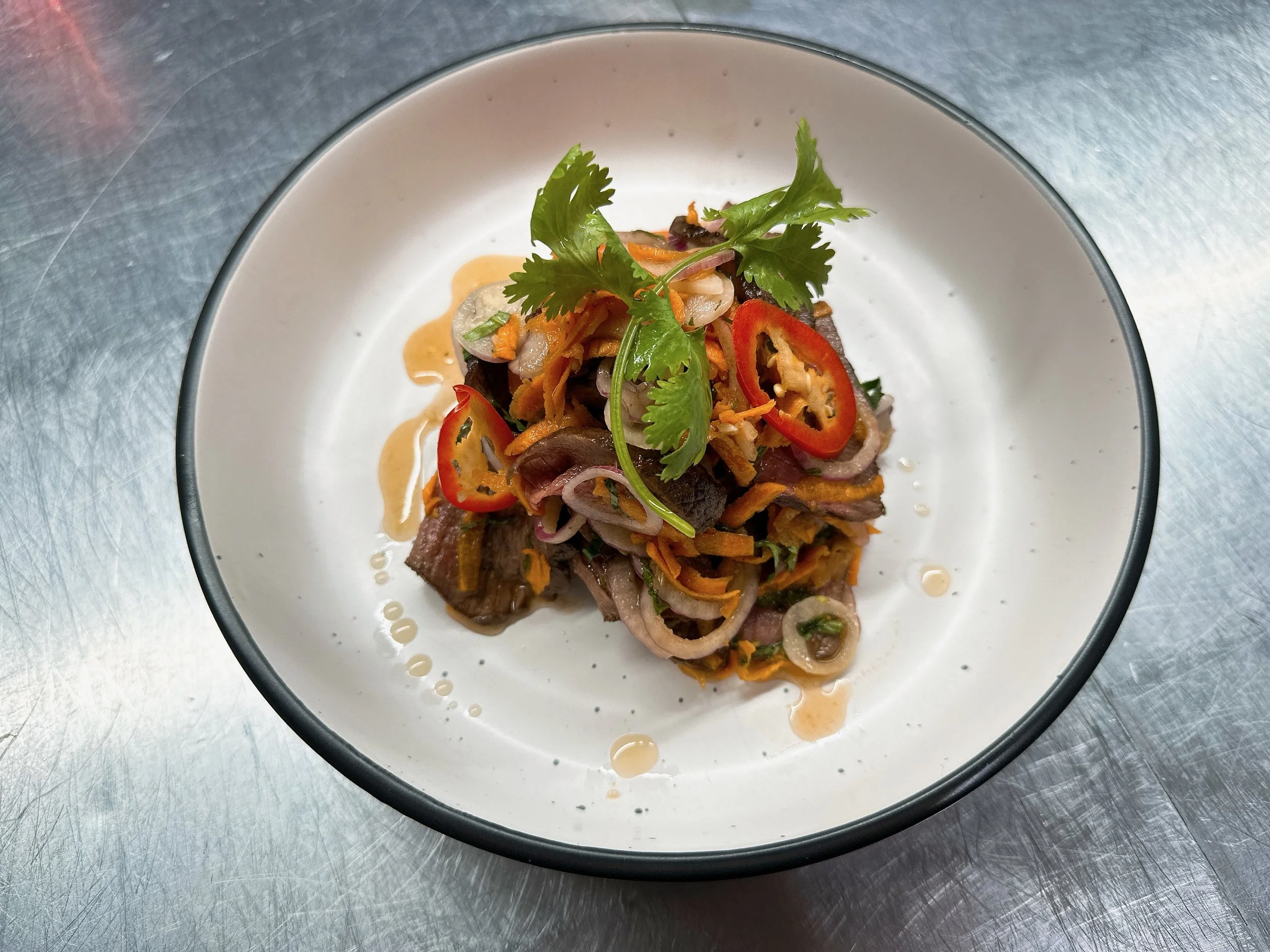 Vietnamese dish with fresh herbs, vegetables and sauce at Barossa Pho