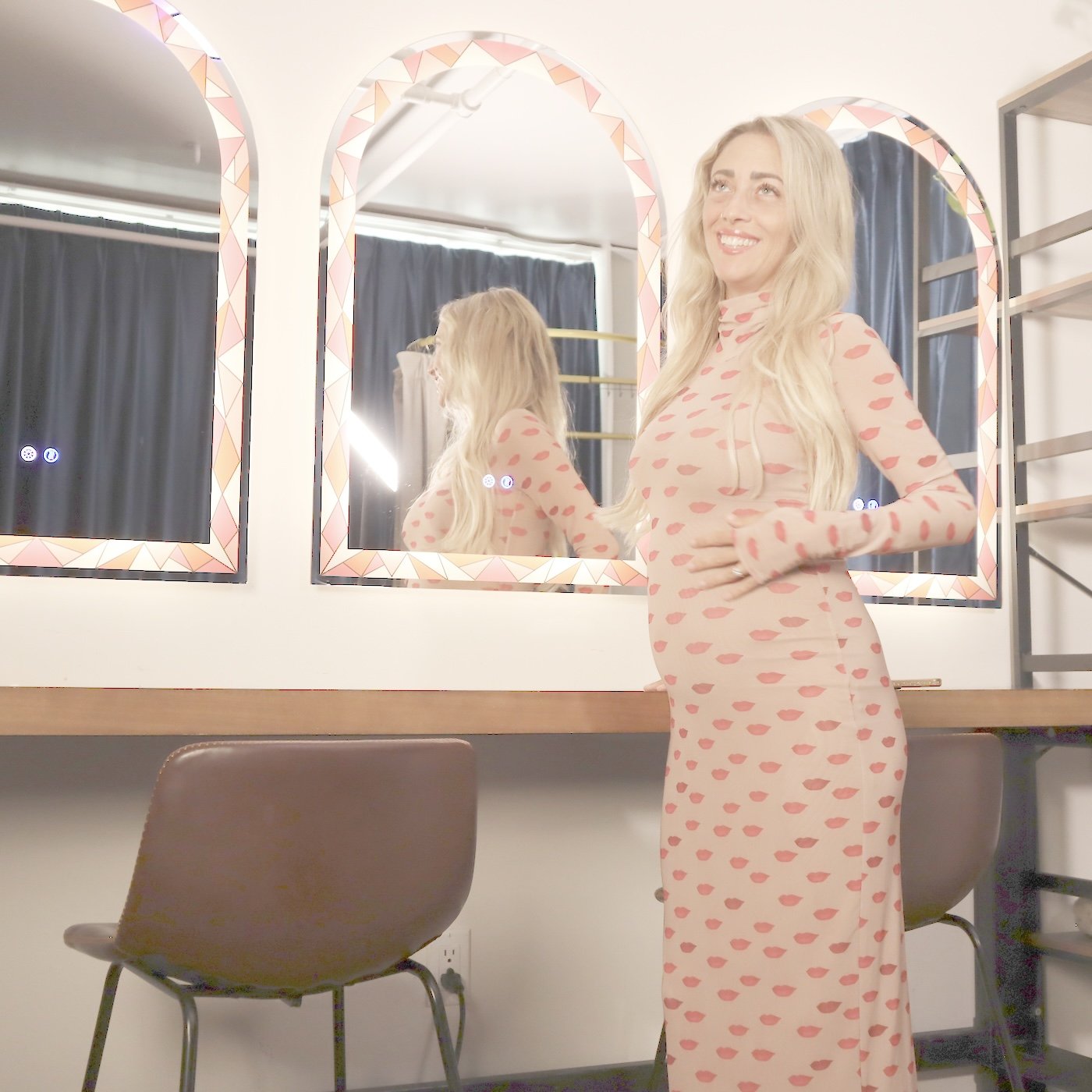 Speaker preparing at the green-room makeup counter and mirrors at Kama