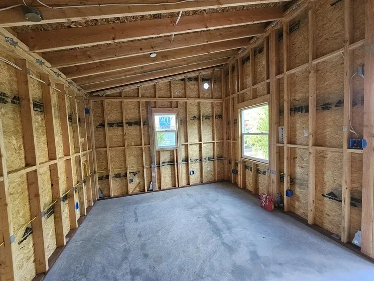 Electrical wiring and boxes in a framed room at a Right Electrical Solutions project