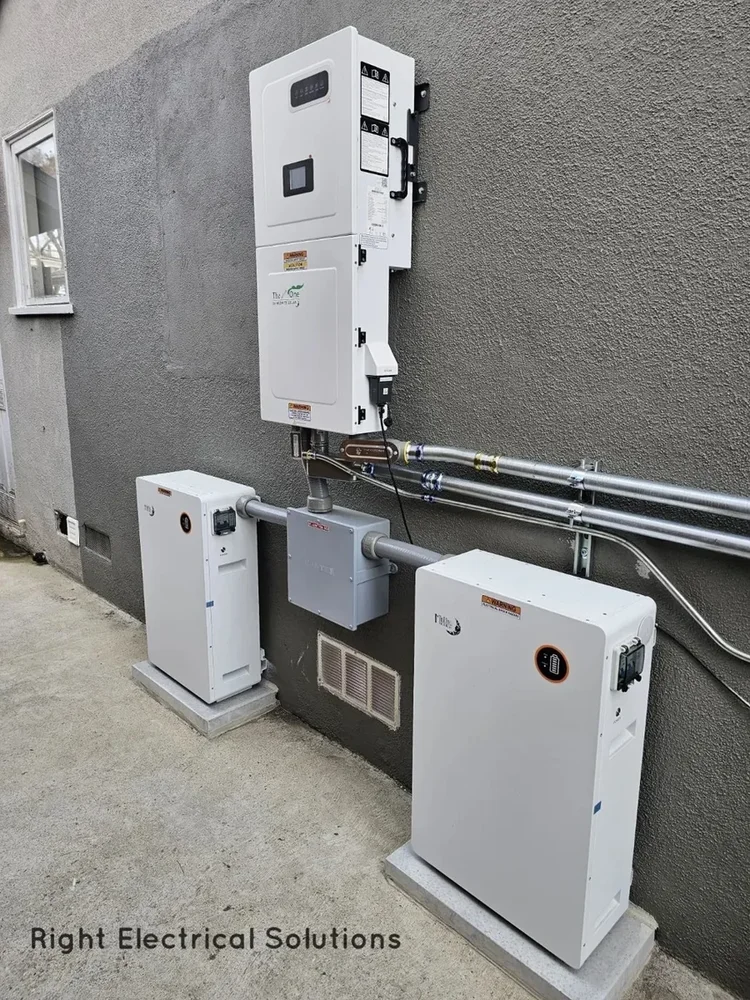 Inverter and two installed battery units at a Right Electrical Solutions project