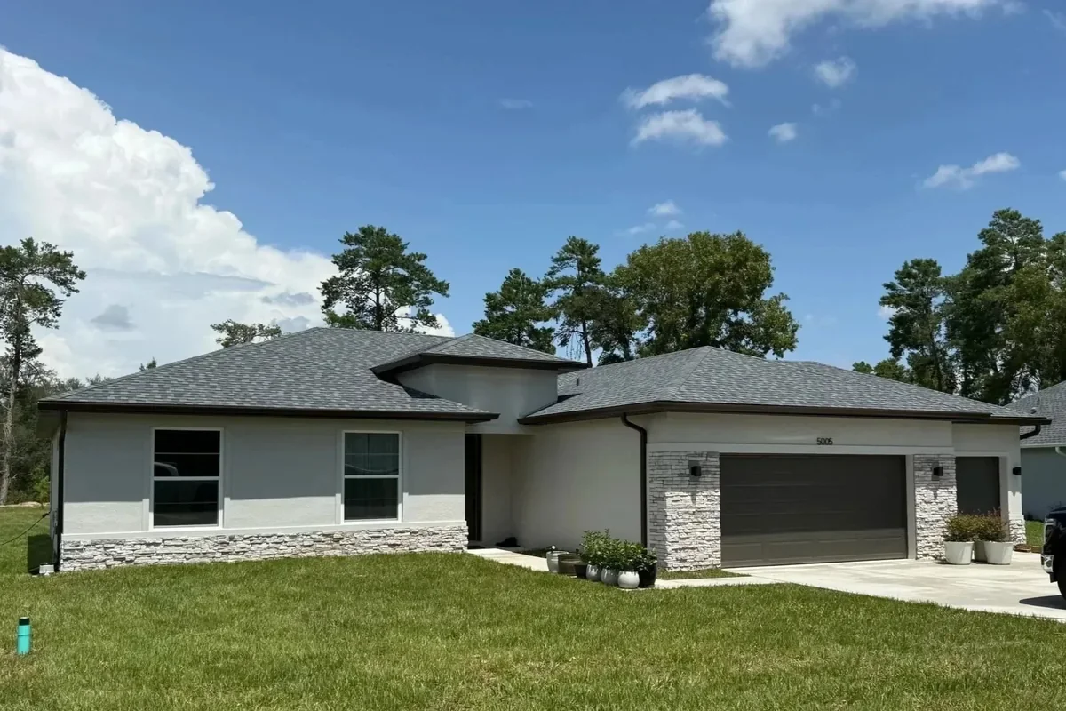 Royal brown seamless gutters installed on a home in Citrus Springs, Florida.