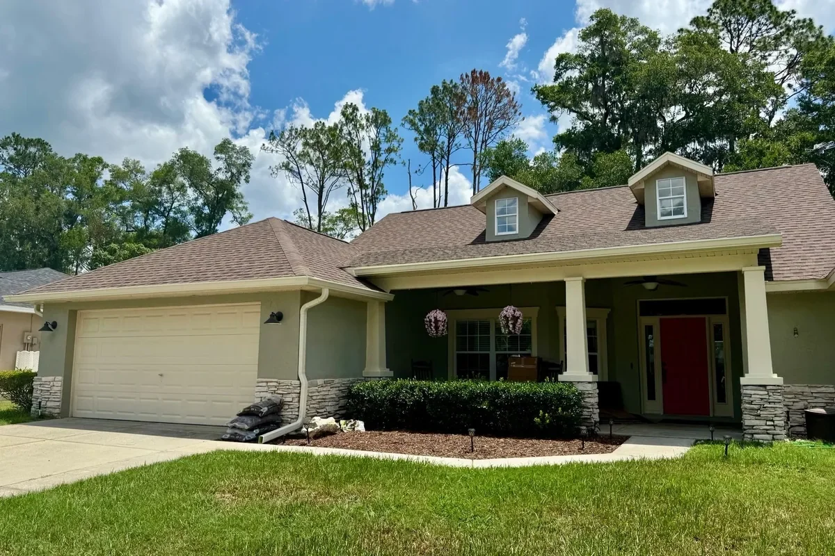 Cream seamless gutters installed on a home in Indian Pines V in Ocala, Florida.