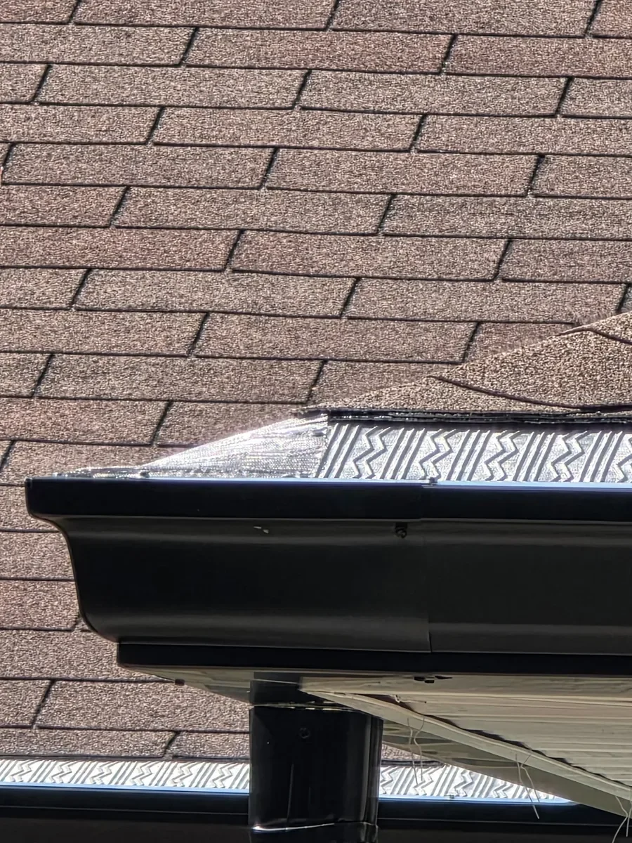 Dark Bronze gutter guard installed on seamless gutter in Dunnellon, Florida