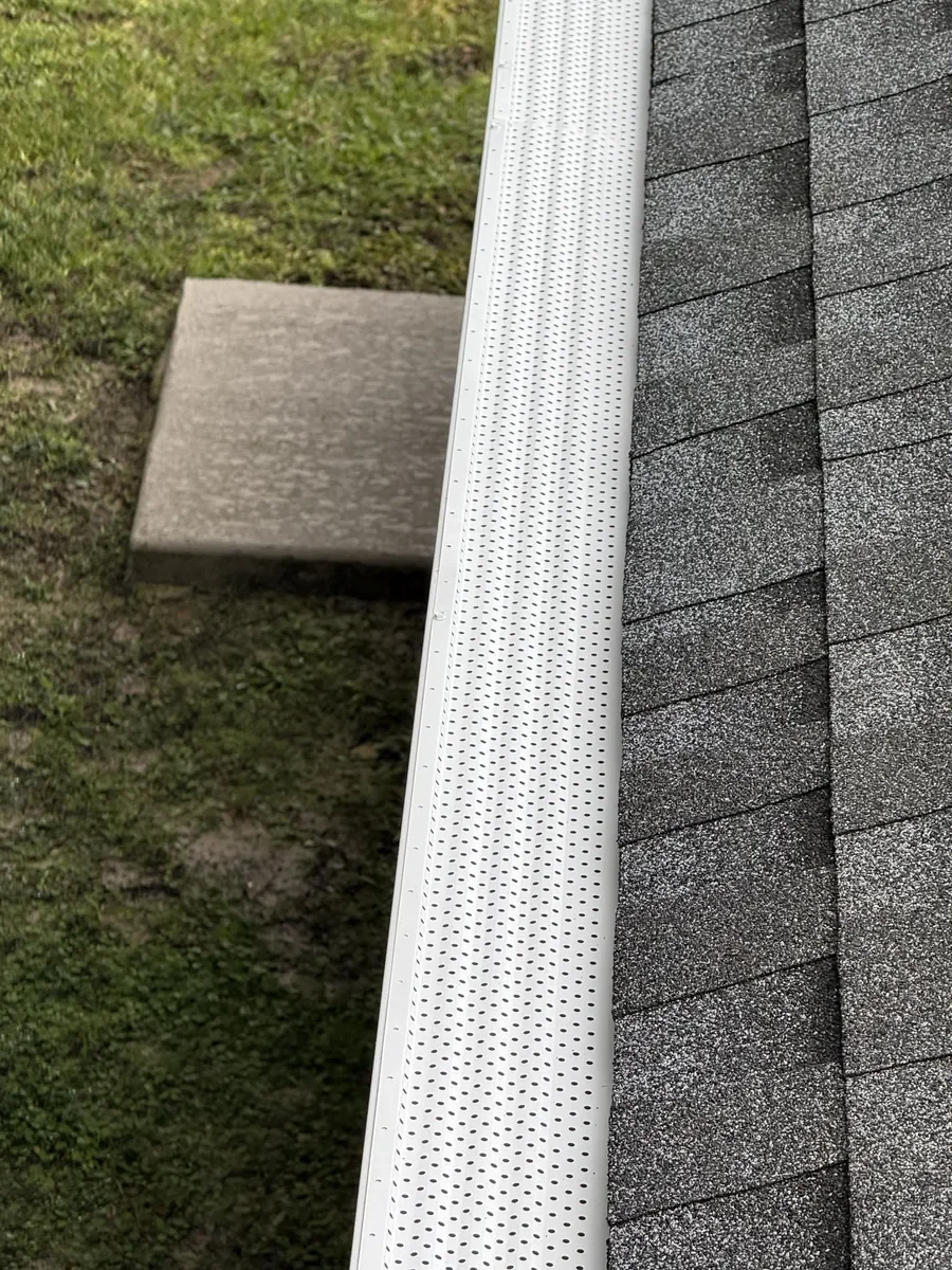 White gutter guard installed on seamless gutter system in Dunnellon