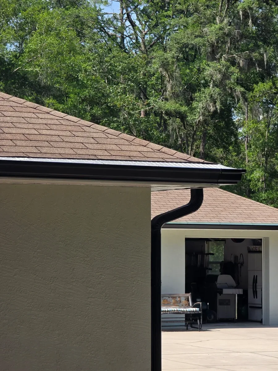 Dark Bronze seamless gutter and downspout installed on Dunnellon home