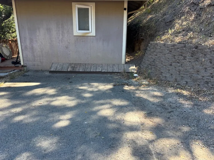 Driveway beside the house after the pile was removed