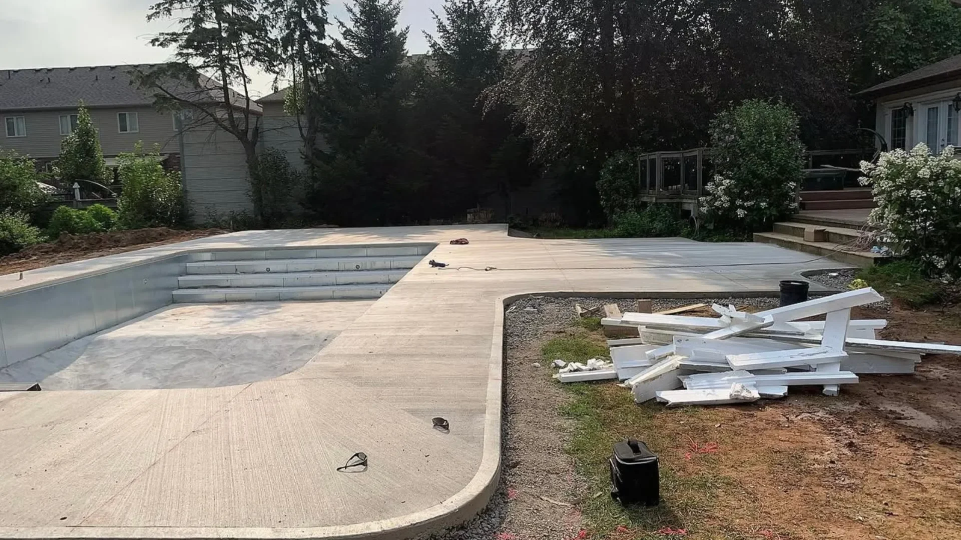 Finished concrete pool shell with broom-finish deck in Niagara Falls