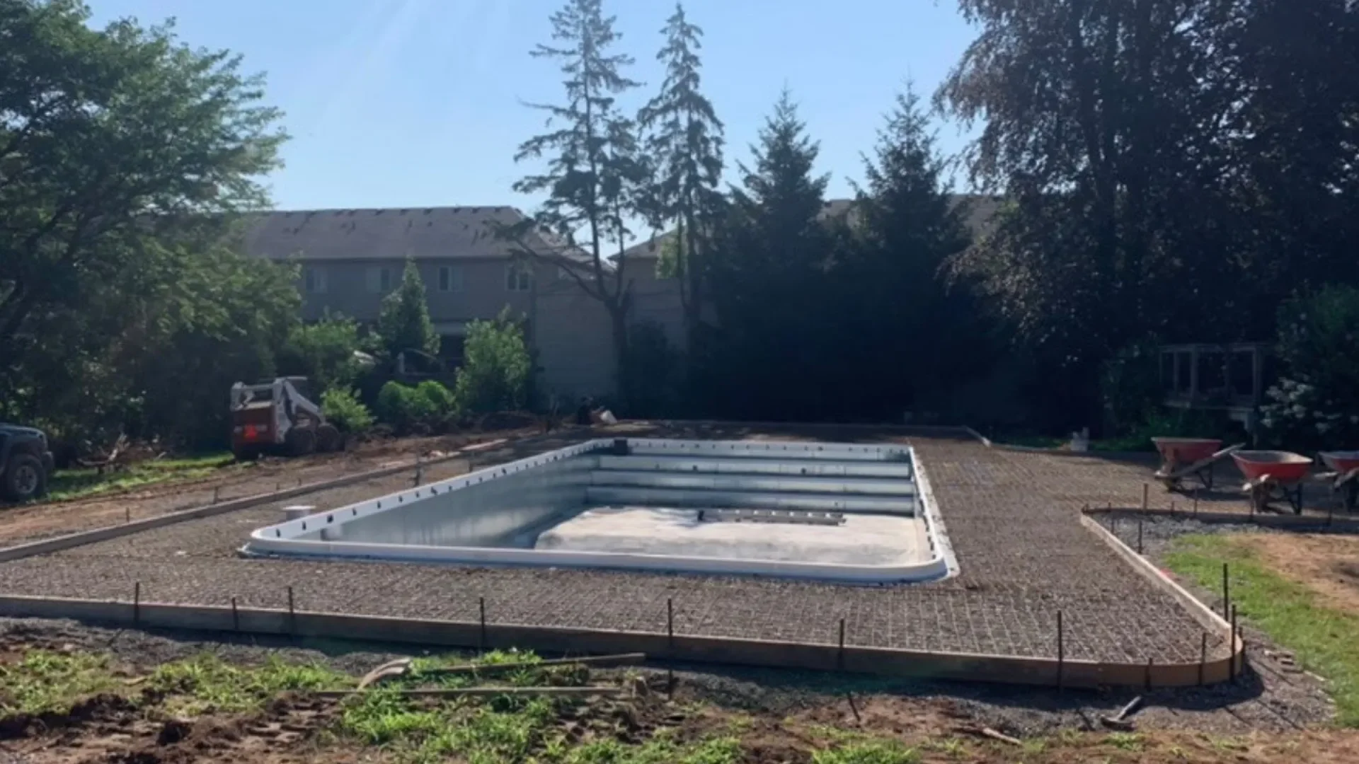 Concrete pool base preparation with gravel and rebar in Niagara Falls