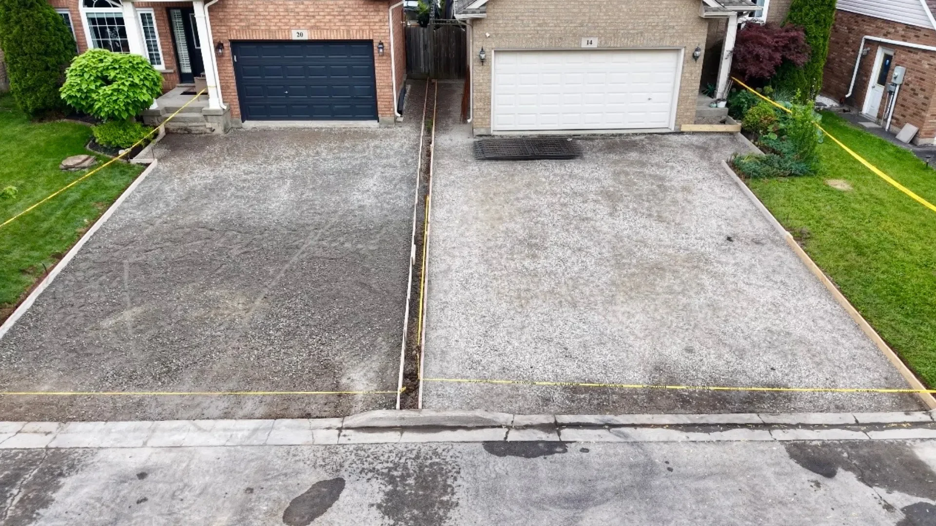 Two Lincoln driveways prepared with gravel base and wooden forms before the pour
