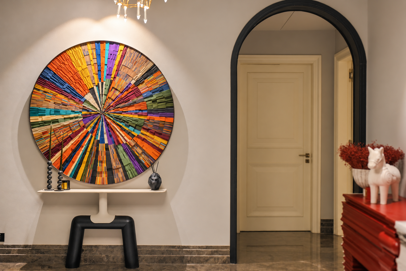 A circular multicoloured artwork above an architectural console.