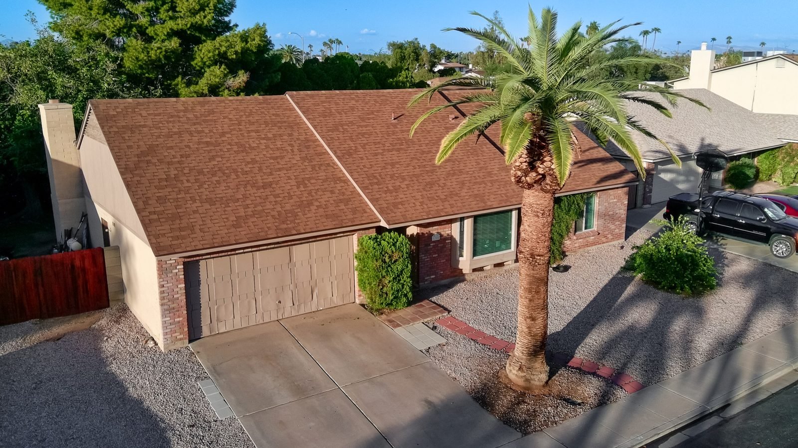Aerial drone photo of a Glendale home with mature landscaping