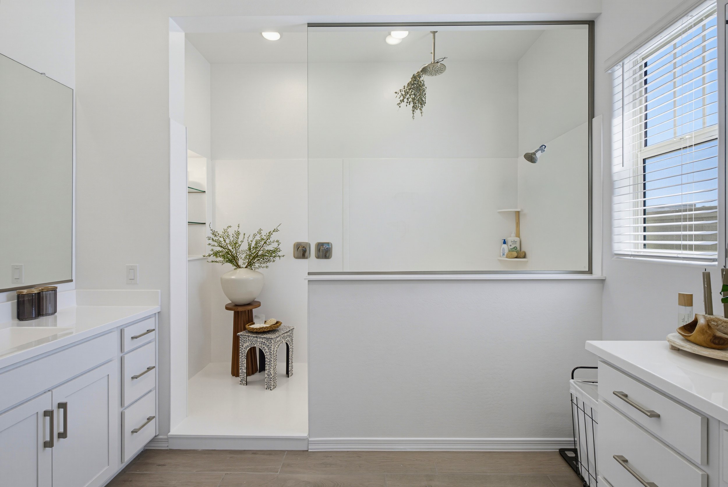 Primary bedroom with hardwood floors and French doors to backyard in a Phoenix listing