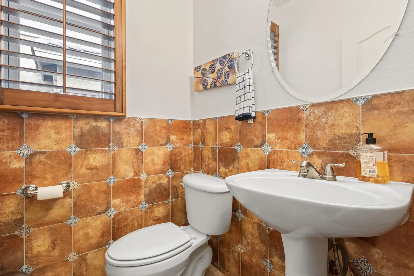 Bathroom with patterned tile in an older Mesa home
