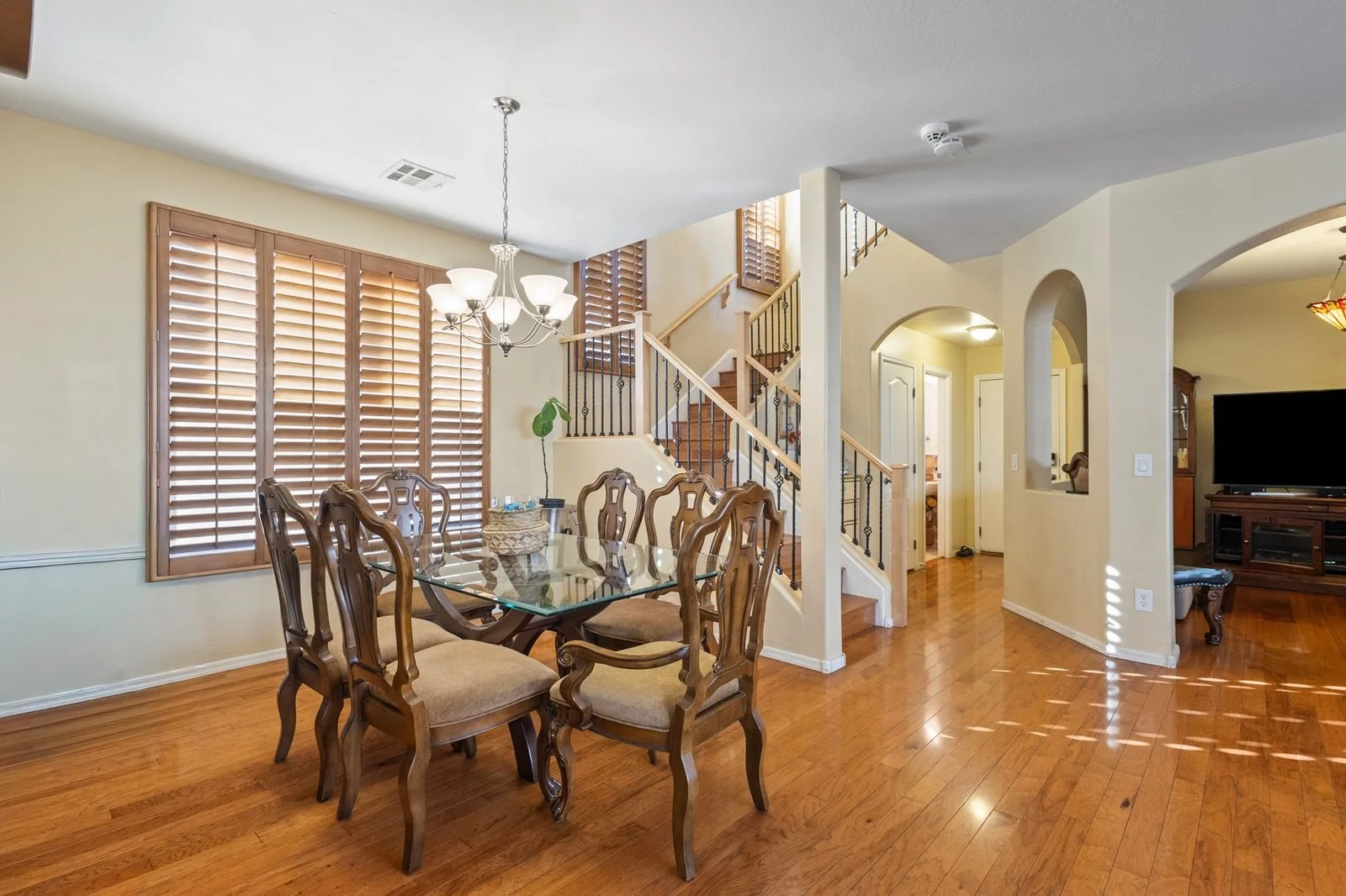 Open dining area with staircase in a two-story Mesa home