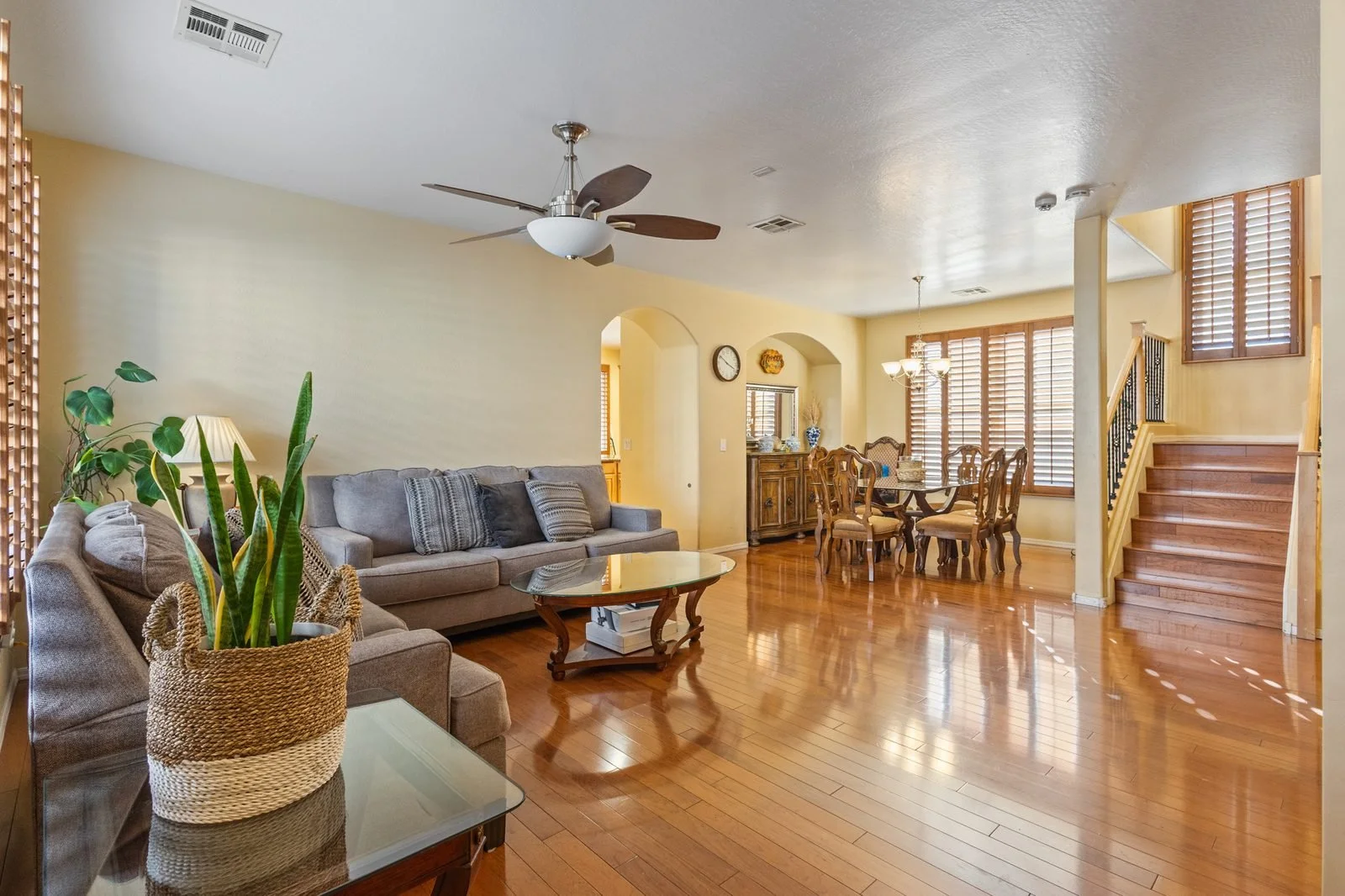 Open living and dining room with hardwood floors in a Mesa home