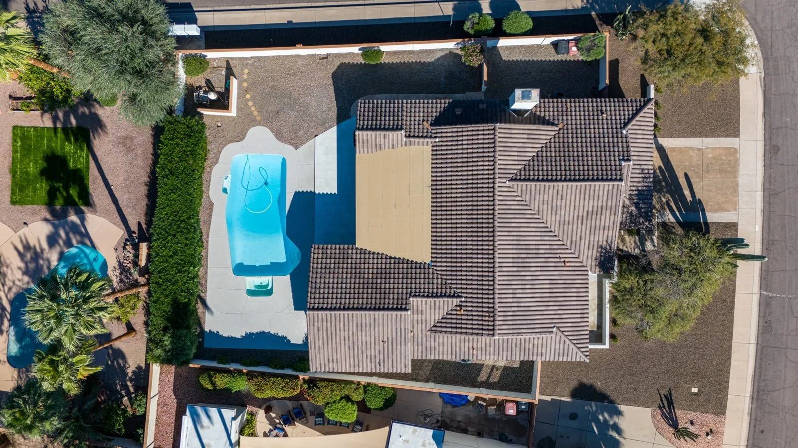 Aerial drone photo of a Scottsdale home with pool and backyard