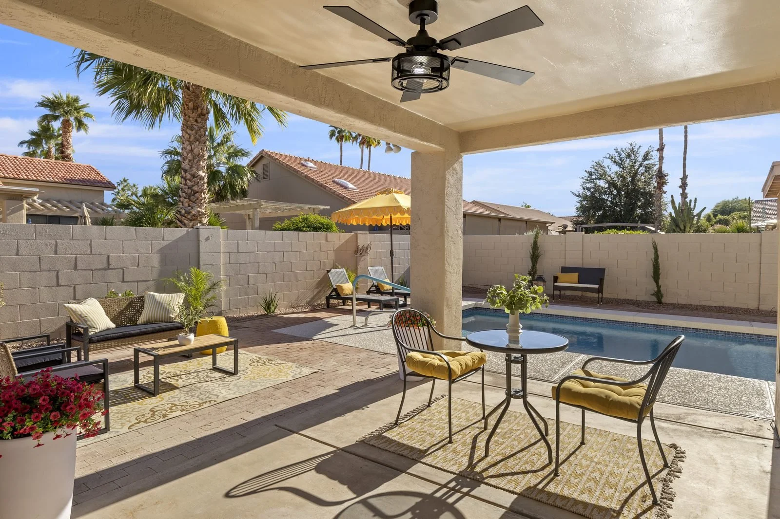 Backyard pool and covered patio of a Glendale home, photographed by Valley View Photo