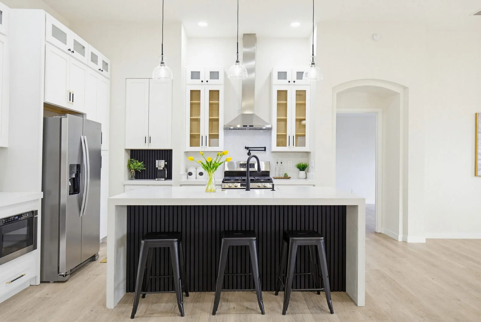 Modern kitchen island with pendant lighting in a Surprise-area home