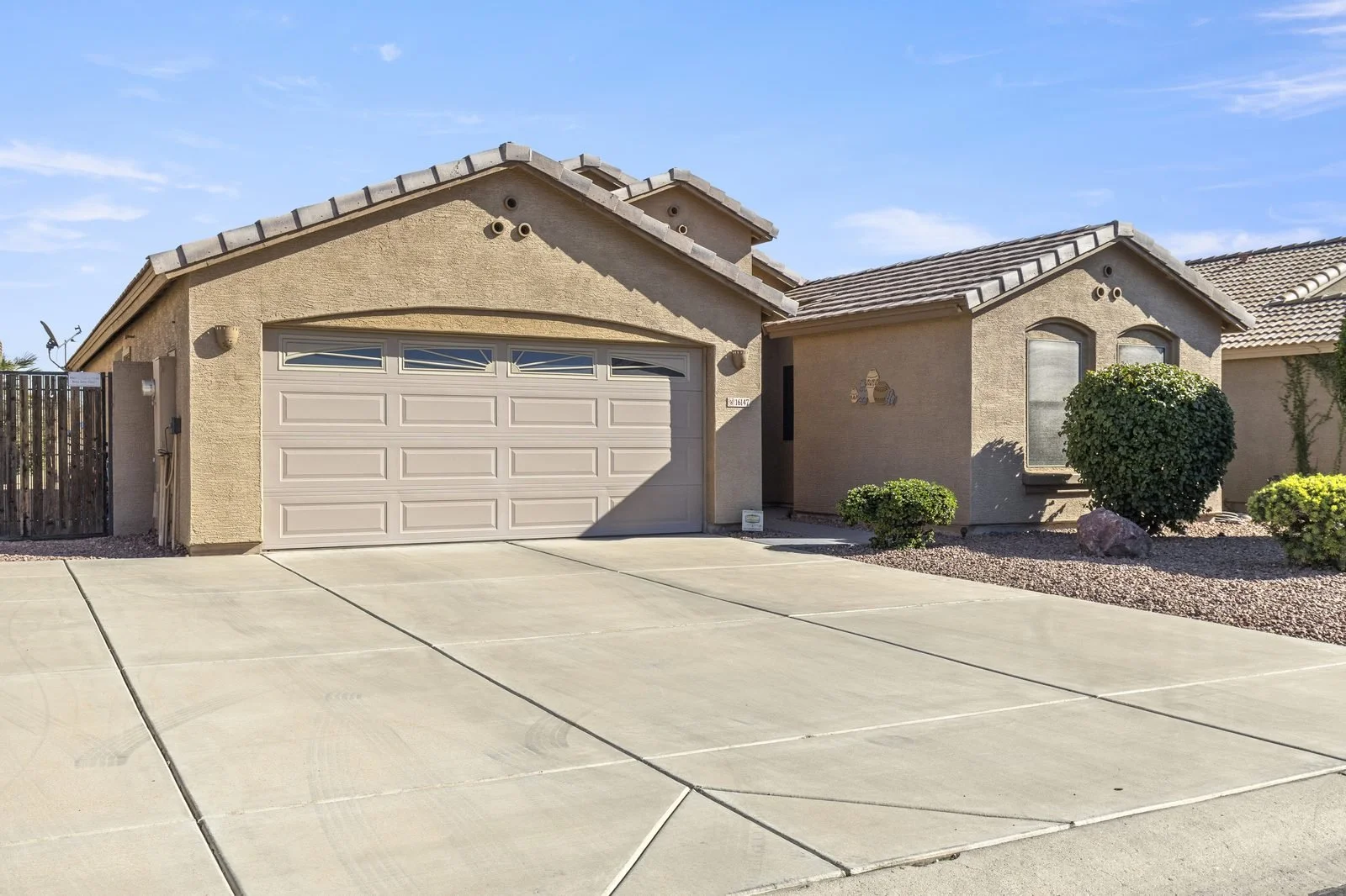 Front exterior of a single-story Glendale, AZ home with desert landscaping, photographed by Valley View Photo