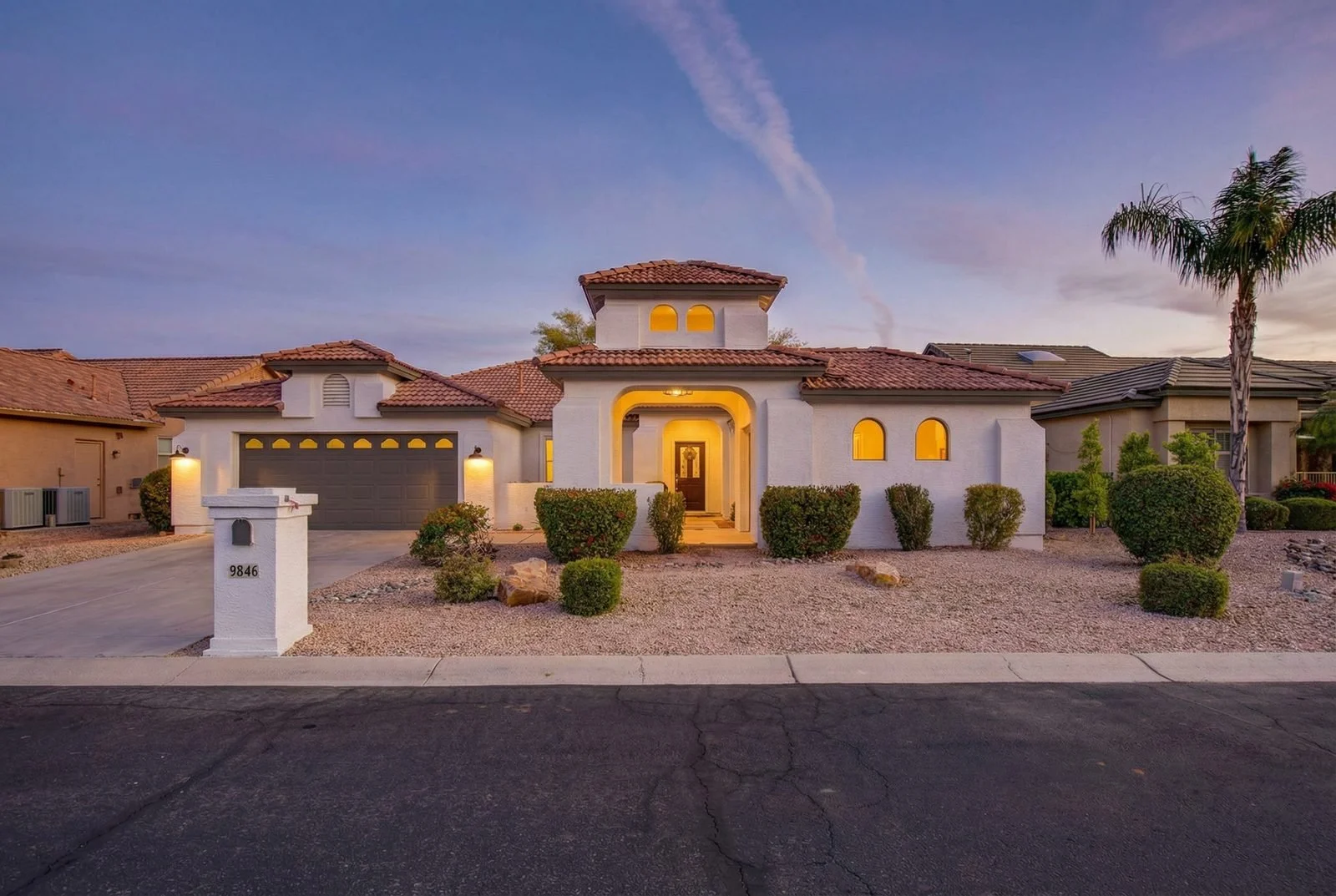 Aerial view of a master-planned community with golf course and lake in Surprise, AZ, photographed by Valley View Photo