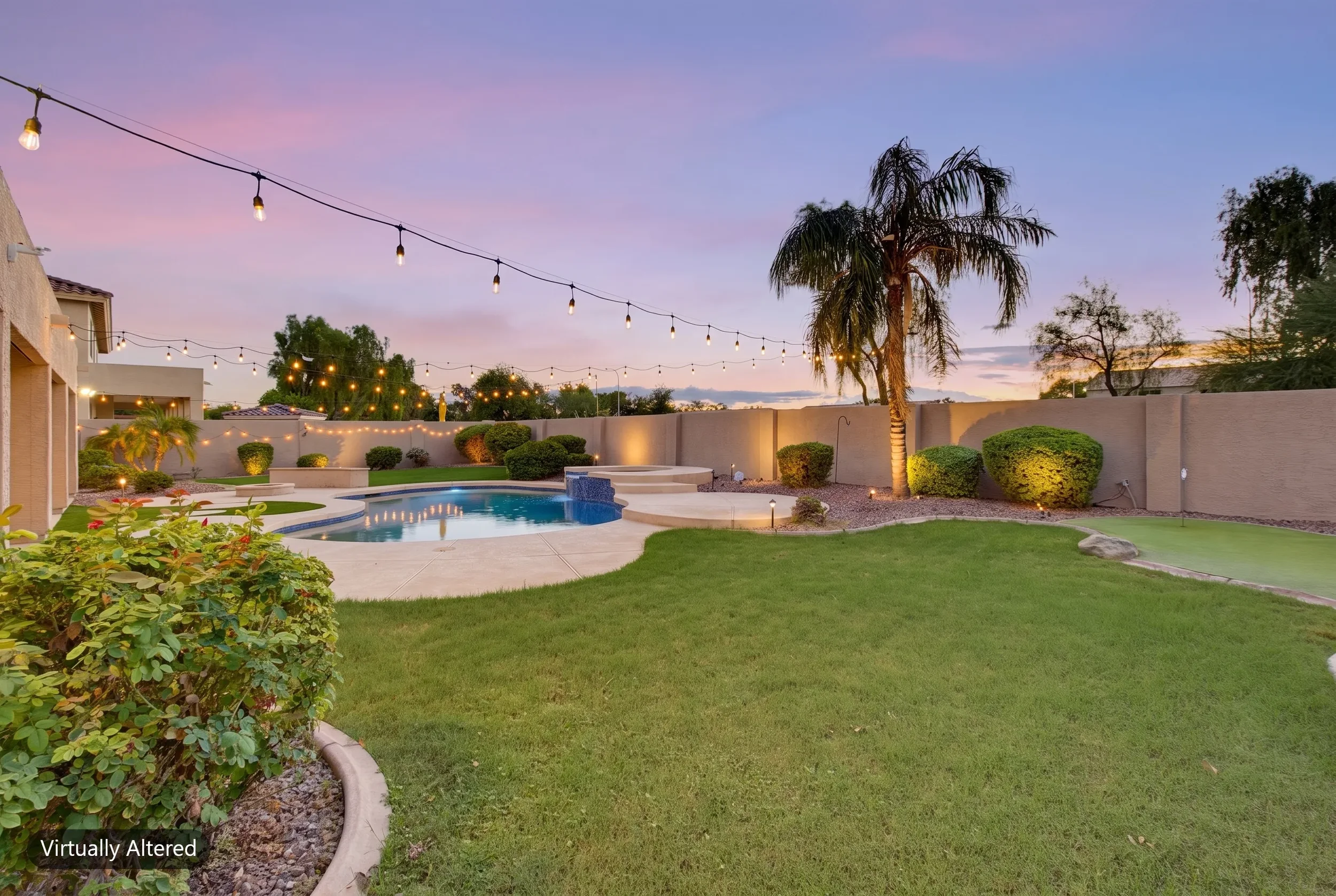 Backyard lawn and pool under string lights with a digital twilight sky